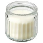 JÄMLIK Scented candle in glass, Vanilla/light beige, 12 hr